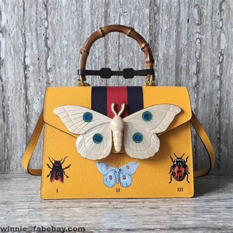 gucci top handle tote bag with moth